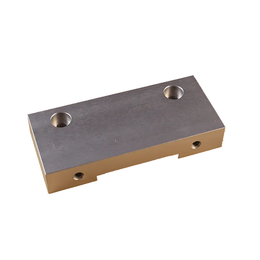 A silver metal aluminum anodized mounting adapter by j2x systems with two M5 threaded holes on the bottom surface.